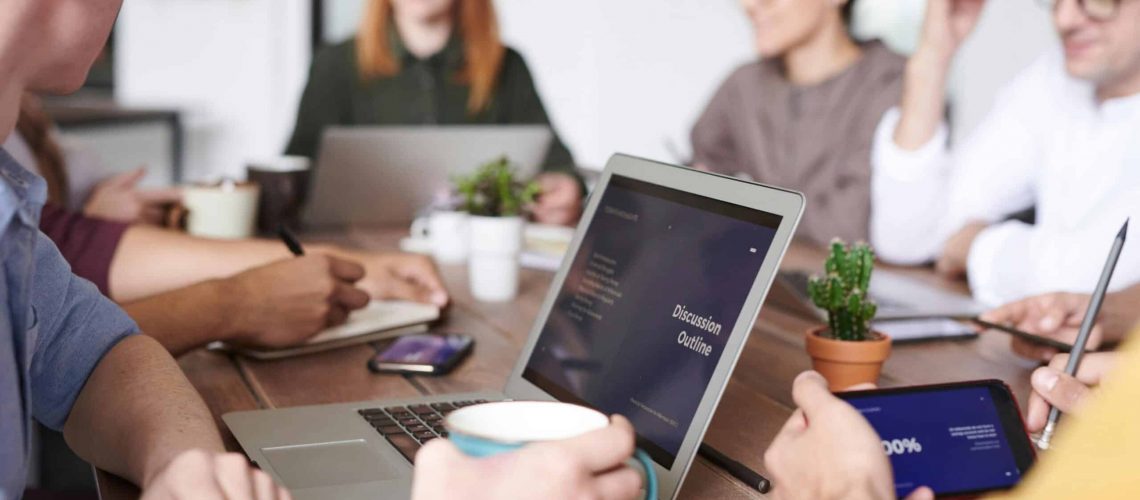 Residents and board members discuss community involvement at a meeting.