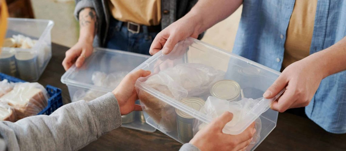 Volunteers packing food for Thanksgiving charity event in Houston.