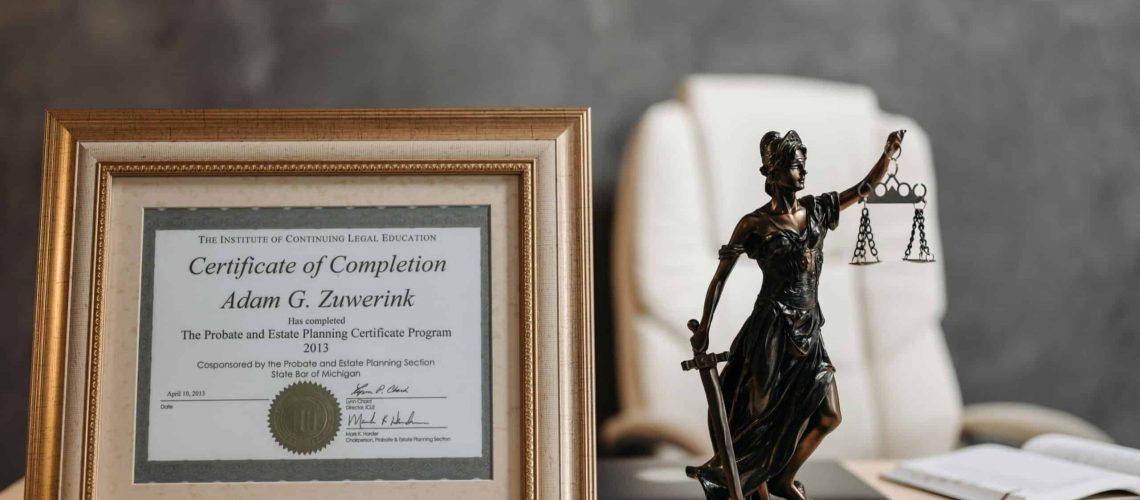 HOA management certification displayed with legal symbols and a statue of Lady Justice.