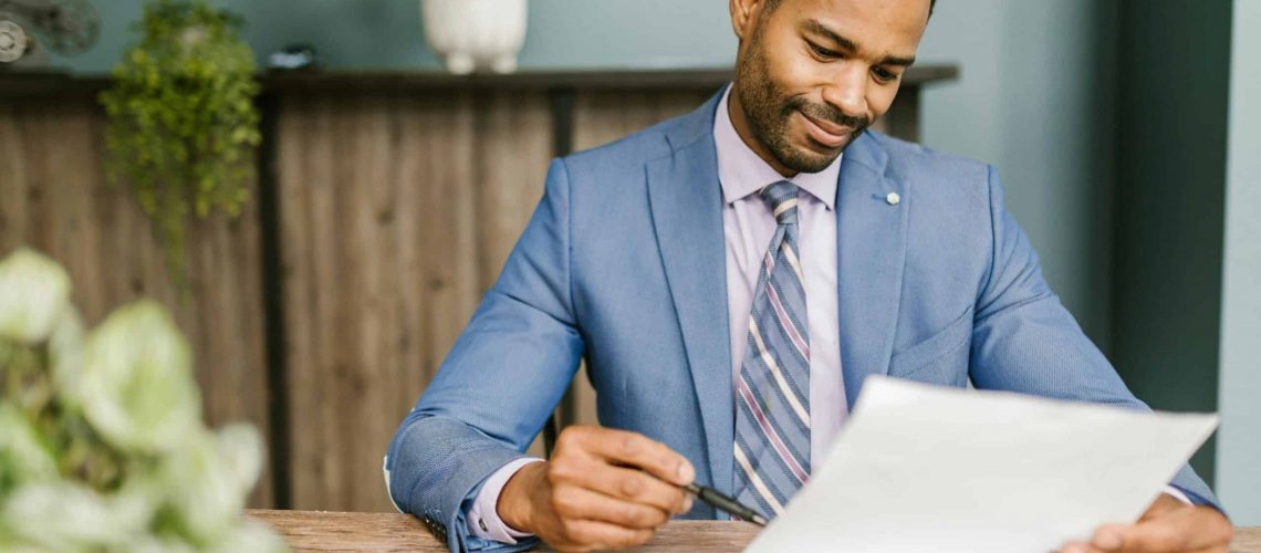Community manager analyzing neighborhood plans for community improvement.