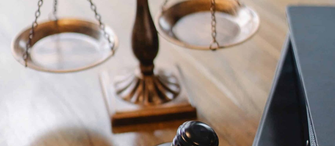 Legal scales symbolizing HOA regulations and legal review process.