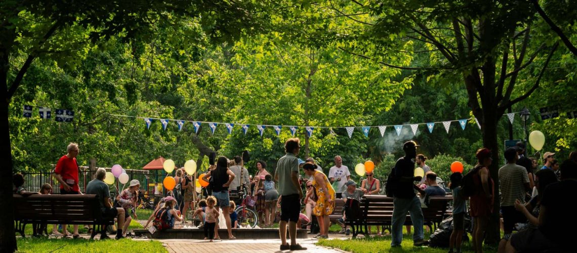 Community gathering at a park in Houston with families and neighbors.