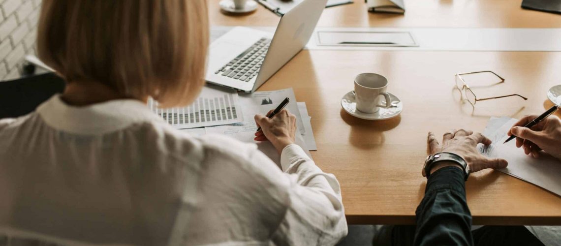 Business meeting discussing the Corporate Transparency Act and HOA compliance.