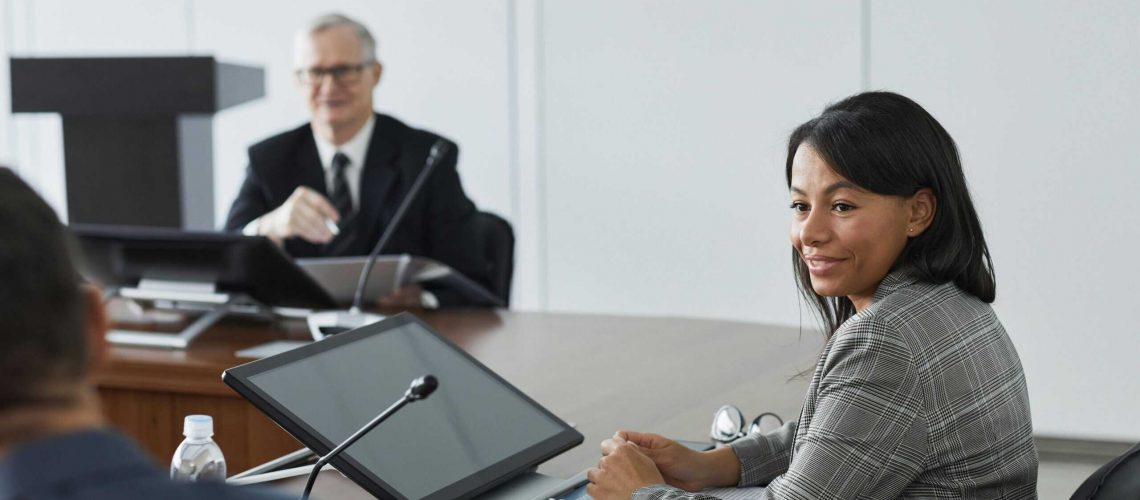 HOA board member participating in a professional meeting about community management.