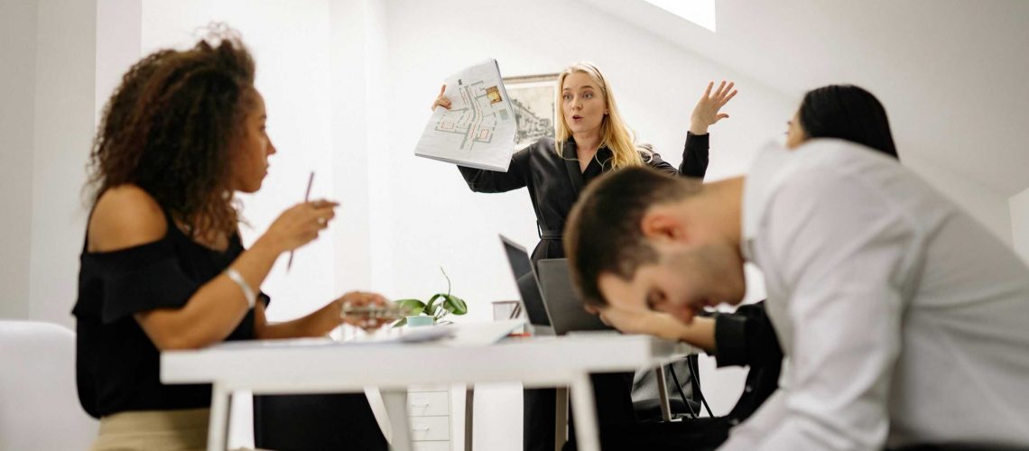 HOA board members in dispute during a meeting, discussing community issues.